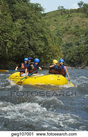 Five people rafting in a river View Large Photo Image Stock Image - Five people rafting in a river. Fotosearch