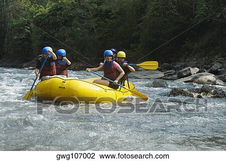 Five people rafting in a river View Large Photo Image Stock Image - Five people rafting in a river. Fotosearch
