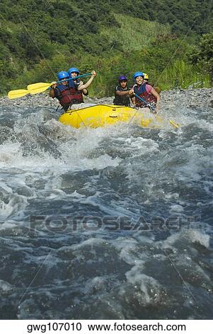 Five people rafting in a river View Large Photo Image Stock Image - Five people rafting in a river. Fotosearch