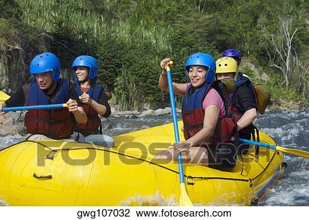 Five people rafting in a river View Large Photo Image Stock Image - Five people rafting in a river. Fotosearch