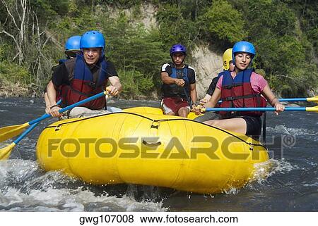 Five people rafting in a river View Large Photo Image Stock Photo - Five people rafting in a river. Fotosearch