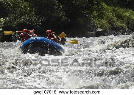 Stock Photo - Five people rafting in a river. Fotosearch