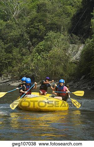 Five people rafting in a river View Large Photo Image Stock Photo - Five people rafting in a river. Fotosearch