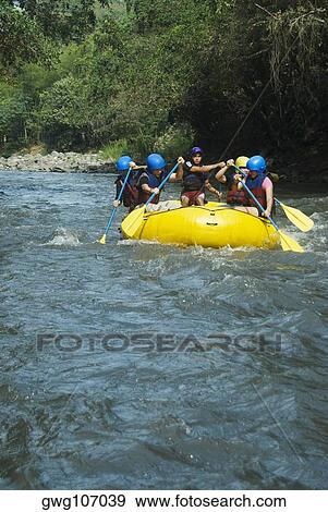 Five people rafting in a river View Large Photo Image Stock Photo - Five people rafting in a river. Fotosearch
