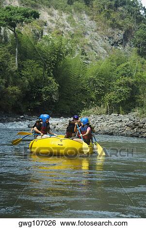 Four people rafting in a river View Large Photo Image Stock Photograph - Four people rafting in a river. Fotosearch