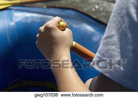 Mid section view of a person rafting View Large Photo Image Stock Photograph - Mid section view of a person rafting. Fotosearch