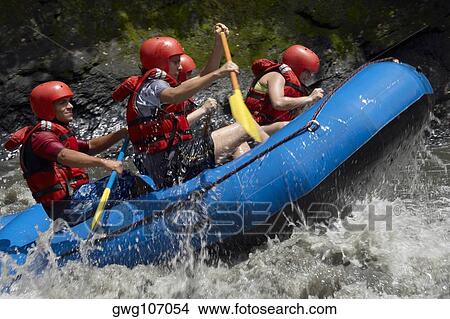 Side profile of five people rafting in a river View Large Photo Image Picture - Side profile of five people rafting in a river. Fotosearch