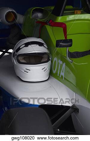 Close-up of a crash helmet on a racecar View Large Photo Image Stock Image - Close-up of a crash helmet on a racecar. Fotosearch
