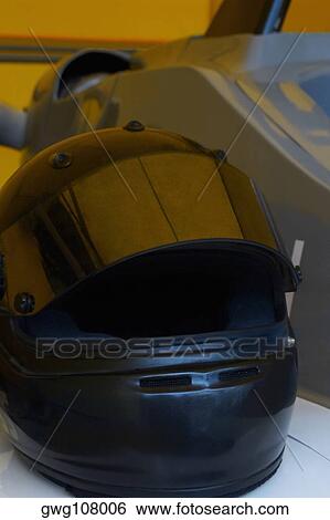 Close-up of a crash helmet on a racecar View Large Photo Image Stock Photograph - Close-up of a crash helmet on a racecar. Fotosearch
