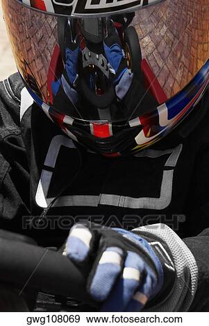 Close-up of a person go-carting View Large Photo Image Stock Photo - Close-up of a person go-carting. Fotosearch