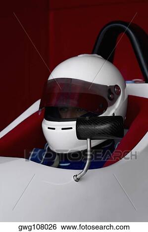 Close-up of a racecar driver in a racecar View Large Photo Image Stock Photograph - Close-up of a racecar driver in a racecar. Fotosearch