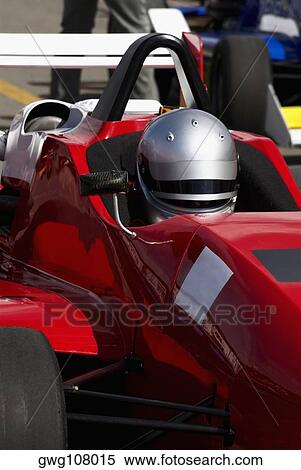 Stock Photography - Close-up of a racecar driver in a racecar. Fotosearch