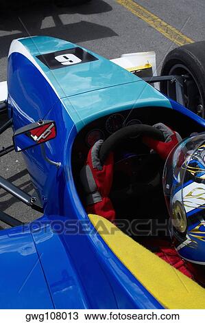 High angle view of a racecar driver in a racecar View Large Photo Image Stock Image - High angle view of a racecar driver in a racecar. Fotosearch