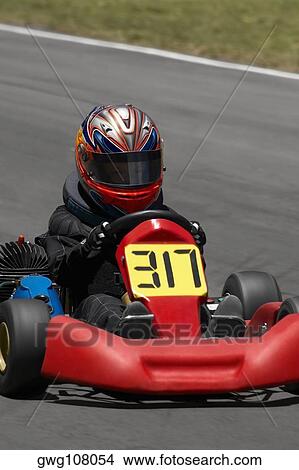 Person go-carting on a motor racing track View Large Photo Image Picture - Person go-carting on a motor racing track. Fotosearch