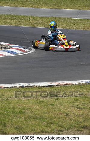 Person go-carting on a motor racing track View Large Photo Image Stock Photography - Person go-carting on a motor racing track. Fotosearch