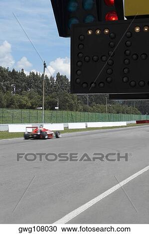 Racecar racing on a motor racing track View Large Photo Image Stock Image - Racecar racing on a motor racing track. Fotosearch