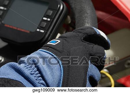 Close-up of a person's hand on the steering wheel of a go-cart View Large Photo Image Stock Photo - Close-up of a person's hand on the steering wheel of a go-cart. Fotosearch