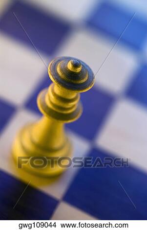 Close-up of a queen chess piece on a chessboard View Large Photo Image Picture - Close-up of a queen chess piece on a chessboard. Fotosearch