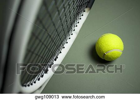Close-up of a tennis racket with a tennis ball View Large Photo Image Stock Image - Close-up of a tennis racket with a tennis ball. Fotosearch