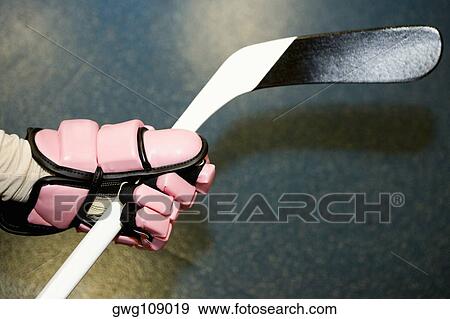 Close-up of an ice hockey player's hand holding an ice hockey stick View Large Photo Image Stock Photo - Close-up of an ice hockey player's hand holding an ice hockey stick. Fotosearch