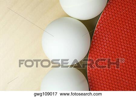 Close-up of three table tennis balls with a table tennis racket View Large Photo Image Stock Photo - Close-up of three table tennis balls with a table tennis racket. Fotosearch