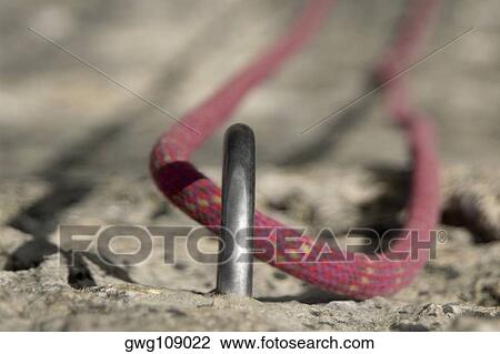 Rock climbing rope in a hook View Large Photo Image Stock Image - Rock climbing rope in a hook. Fotosearch