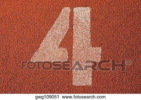 Stock Image - Track number 4 of a running track. Fotosearch
