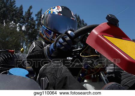 Close-up of a person go-carting View Large Photo Image Picture - Close-up of a person go-carting. Fotosearch