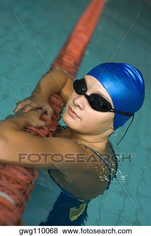 Close-up of a teenage girl resting in a swimming pool View Large Photo Image Stock Photo - Close-up of a teenage girl resting in a swimming pool. Fotosearch