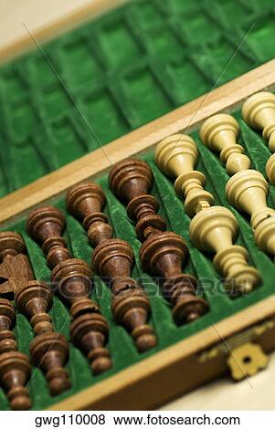 Close-up of chess pieces in a wooden box View Large Photo Image Stock Photo - Close-up of chess pieces in a wooden box. Fotosearch