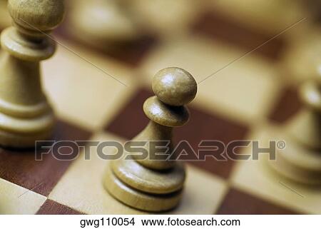 Close-up of chess pieces on a chess board View Large Photo Image Picture - Close-up of chess pieces on a chess board. Fotosearch