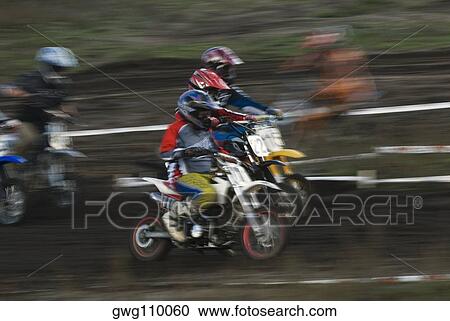 Group of men riding motorcycles in a sports race View Large Photo Image Stock Image - Group of men riding motorcycles in a sports race. Fotosearch