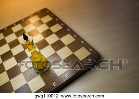 High angle view of a king chess piece on a chessboard View Large Photo Image Stock Image - High angle view of a king chess piece on a chessboard. Fotosearch