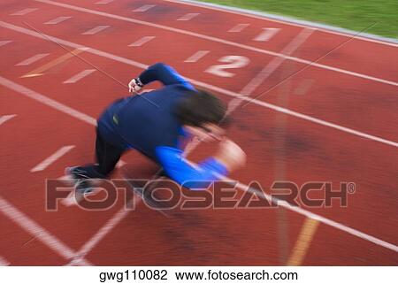 High angle view of a mid adult man at the starting line View Large Photo Image Stock Image - High angle view of a mid adult man at the starting line. Fotosearch