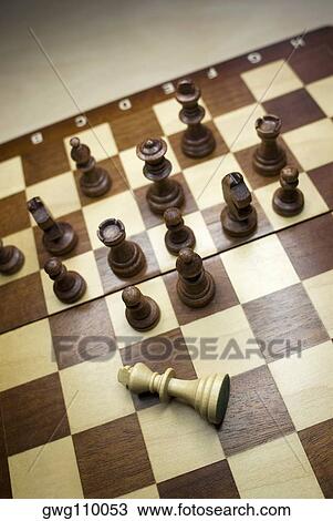 High angle view of chess game with a fallen king View Large Photo Image Stock Image - High angle view of chess game with a fallen king. Fotosearch