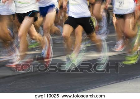 Low section view of male athletes running on a running track View Large Photo Image Stock Photography - Low section view of male athletes running on a running track. Fotosearch