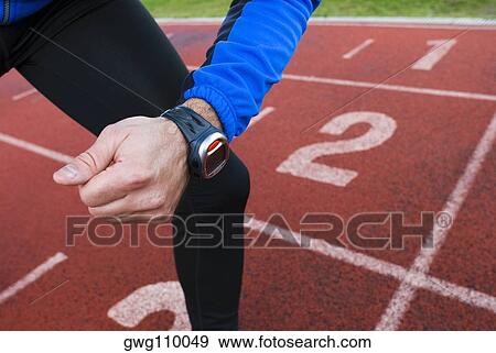 Mid section view of a man at the starting line View Large Photo Image Stock Photo - Mid section view of a man at the starting line. Fotosearch