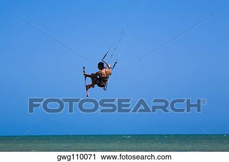 Rear view of a man kite boarding, Smathers Beach, Key West, Florida, USA View Large Photo Image Stock Image - Rear view of a man kite boarding, Smathers Beach, Key West, Florida, USA. Fotosearch