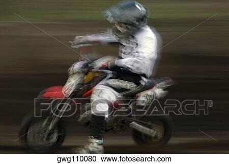 Side profile of a man riding a motorcycle in a sports race View Large Photo Image Stock Image - Side profile of a man riding a motorcycle in a sports race. Fotosearch