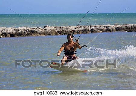 Young man kite boarding in the sea, Smathers Beach, Key West, Florida, USA View Large Photo Image Stock Image - Young man kite boarding in the sea, Smathers Beach, Key West, Florida, USA. Fotosearch