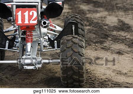 Close-up of a quadbike on sand View Large Photo Image Stock Photography - Close-up of a quadbike on sand. Fotosearch