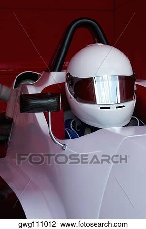 Close-up of a racecar driver in a racecar View Large Photo Image Stock Image - Close-up of a racecar driver in a racecar. Fotosearch