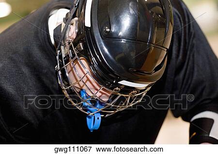 Close-up of a teenage boy in a goalie mask View Large Photo Image Stock Photo - Close-up of a teenage boy in a goalie mask. Fotosearch