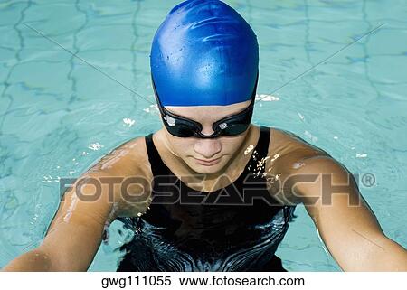 Close-up of a teenage girl swimming in a swimming pool View Large Photo Image Stock Photography - Close-up of a teenage girl swimming in a swimming pool. Fotosearch