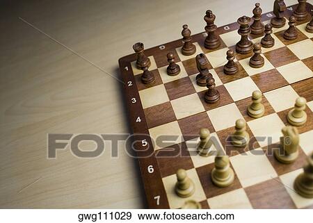 Close-up of chess pieces on a chess board View Large Photo Image Stock Photo - Close-up of chess pieces on a chess board. Fotosearch