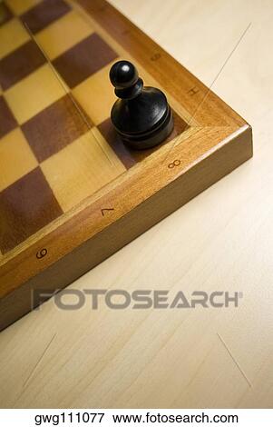 Stock Photo - High angle view of a pawn on a chessboard. Fotosearch