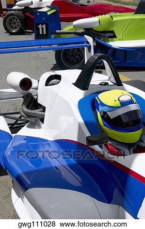 Stock Photo - High angle view of a racecar driver in a racecar. Fotosearch