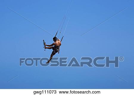 Rear view of a man kite boarding, Smathers Beach, Key West, Florida, USA View Large Photo Image Stock Image - Rear view of a man kite boarding, Smathers Beach, Key West, Florida, USA. Fotosearch
