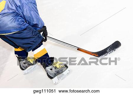 Rear view of a man playing ice hockey View Large Photo Image Stock Image - Rear view of a man playing ice hockey. Fotosearch