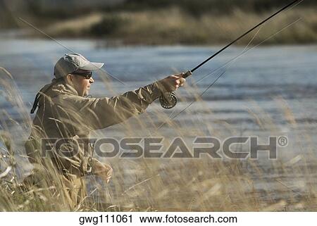 Side profile of a mature man fishing View Large Photo Image Stock Image - Side profile of a mature man fishing. Fotosearch